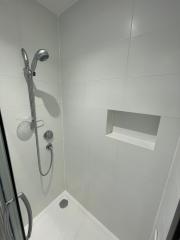 Shower niche within complete bathroom refurbishment by Thomson Properties, Surrey and Sussex