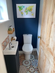 Cloakroom refurbishment with statement colourful patterned tiles by Thomson Properties