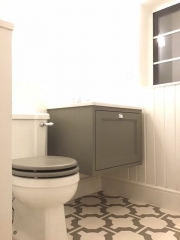 Traditional style bathroom refurbishment with patterned floor tiles by Thomson Properties