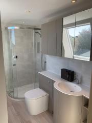 Grey bathroom units - bathroom refurbishment by Thomson Properties