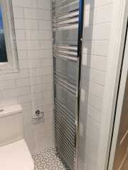 White metro bathroom wall tiles with patterned floor tiles, bathroom refurbishment by Thomson Properties, Kitchen & Bathroom refurbishment Specialists in Surrey and Sussex