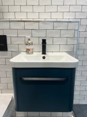 White metro bathroom tiling with black bathroom fittings - Thomson Properties