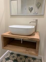 Cloakroom refurbishment with patterned floor tiles by Thomson Properties