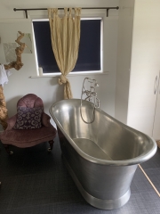 Luxury bathroom with freestanding bath, fitted by Thomson Properties, Surrey and Sussex