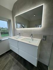 Illuminated bathroom mirror over cabinet bathroom fitting Cranleigh Surrey Sussex Thomson Properties