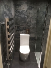 Bathroom refurbishment with grey wall and floor tiles, Thomson Properties