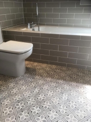Patterned bathroom flooring and metro wall tiling, bathroom fitted by Thomson Properties, Surrey and Sussex