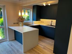 Dark navy blue kitchen with pendant lighting, Elmbridge Village Cranleigh, kitchen fitting Surrey Sussex Thomson Properties