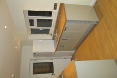 Grey shaker style kitchen refurbishment with wooden worktops and flooring, Thomson Properties