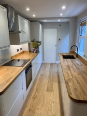 Kitchen refurbishment with wooden worktops and flooring by Thomson Properties