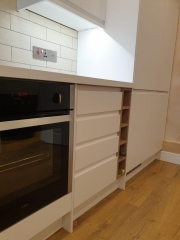 White kitchen cupboards and brick tiles kitchen installer Surrey Thomson Properties