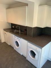 Utility room fitting by Thomson Properties, Surrey and West Sussex