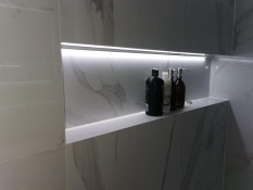 Illuminated bathroom wall niche