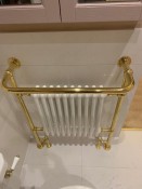 Vintage inspired radiator towel rail with gold surround - Thomson Properties