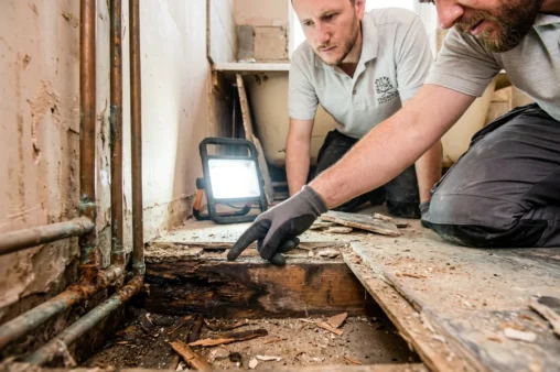 What are the typical hidden extras that push bathroom or kitchen renovation costs higher?